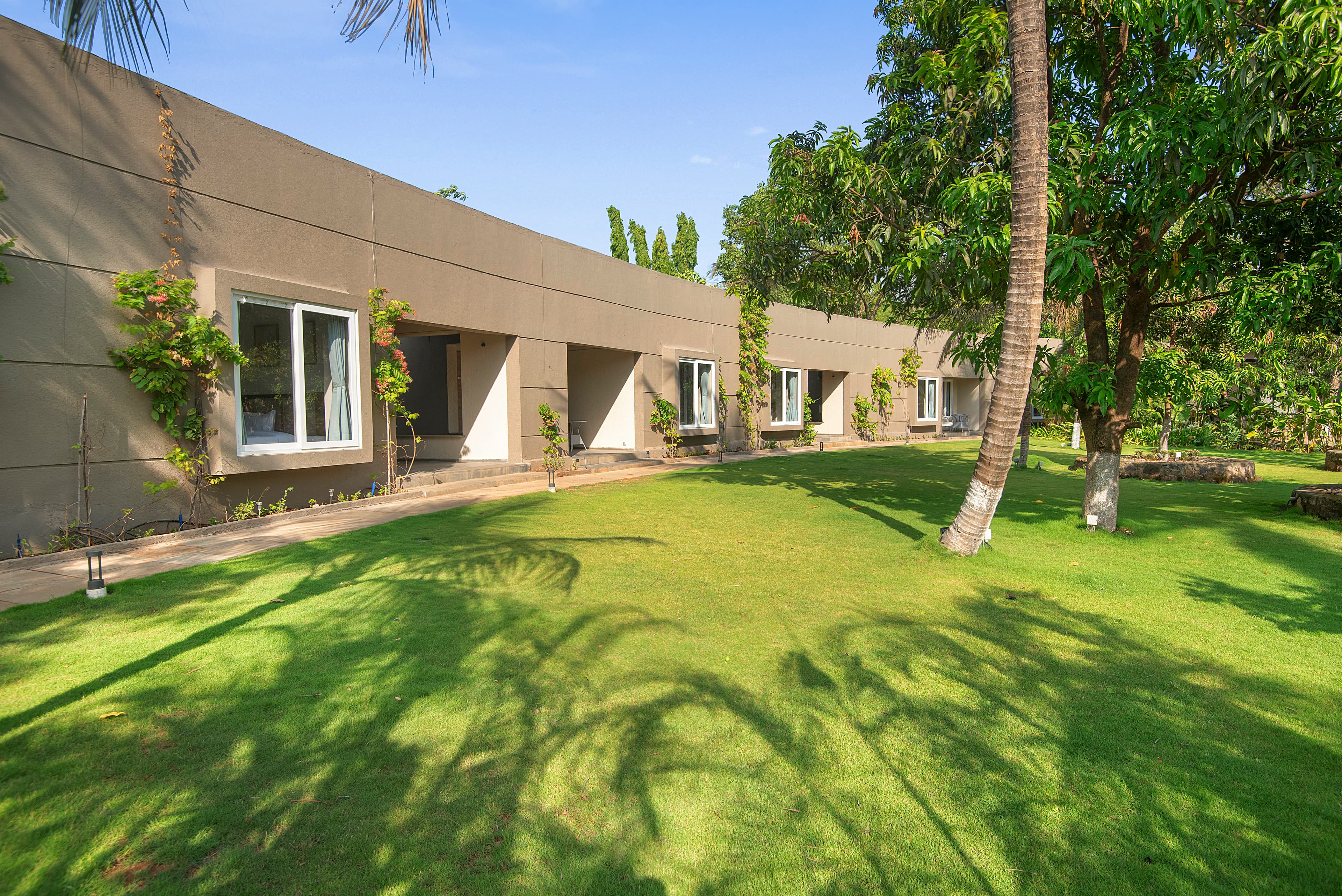 The Crescent Palm Grove | Boutique Suite in a Resort with Shared Game Room, Garden and Restaurant - Image 1